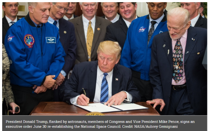 Trump sign executive order reestablishing the National Space Council.